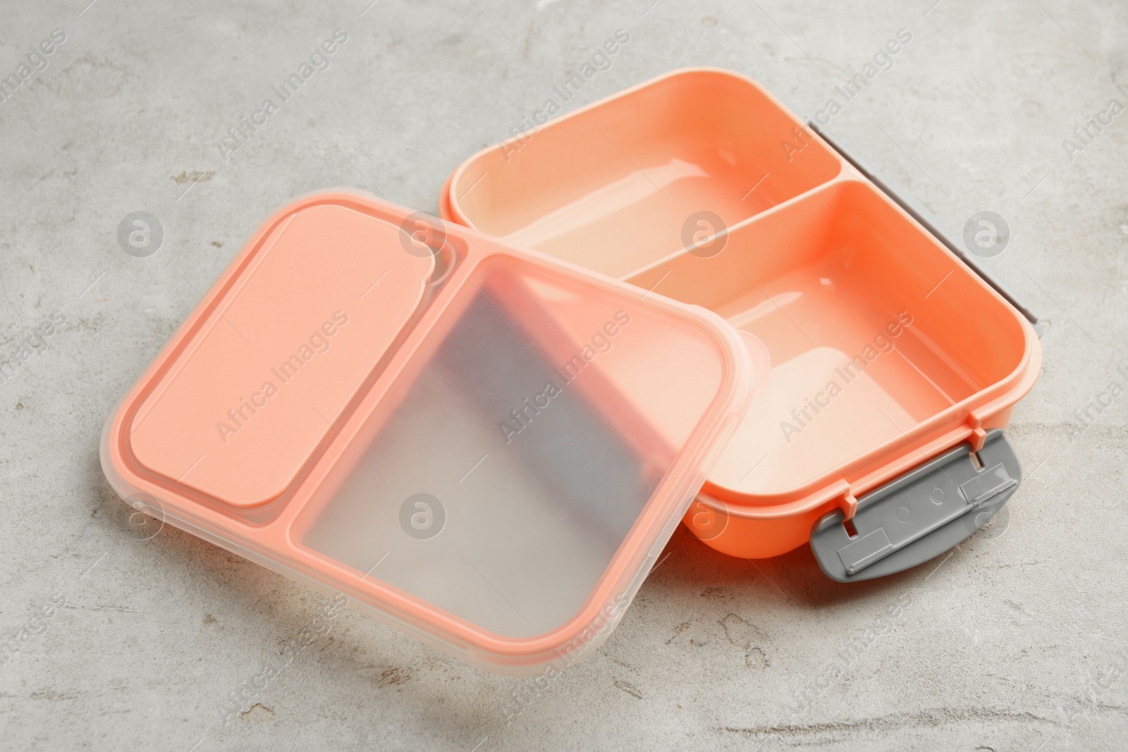 Photo of Empty plastic lunch box on grey table, closeup