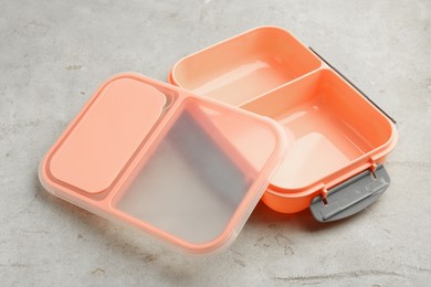 Empty plastic lunch box on grey table, closeup