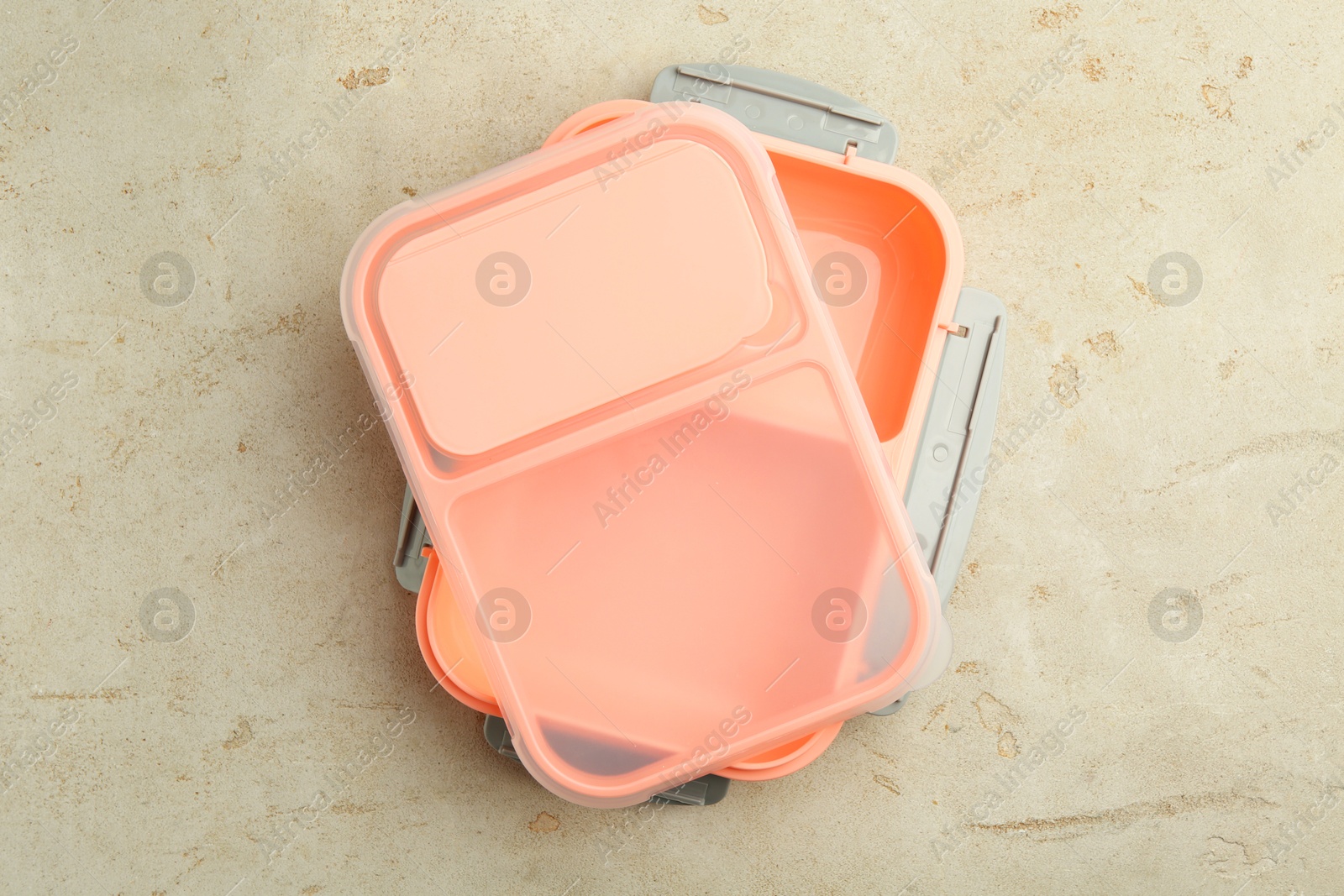 Photo of Empty plastic lunch box on grey table, top view