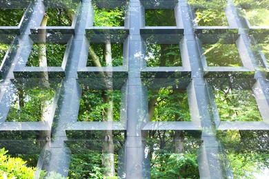 Image of Environment preservation. Modern building and trees, double exposure