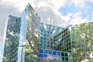 Image of Environment preservation. Double exposure of modern buildings, low angle view