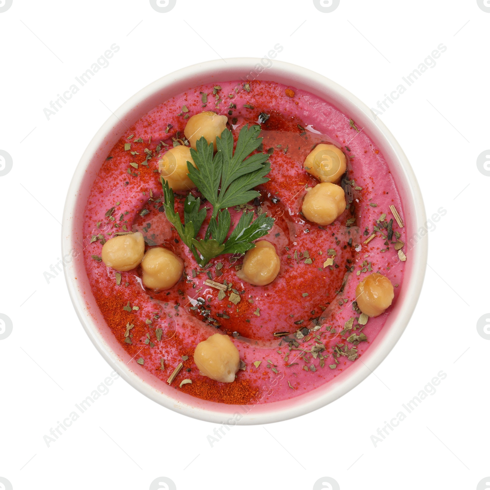 Photo of Tasty beetroot hummus and chickpeas in bowl isolated on white, top view