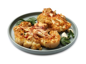 Photo of Delicious baked cauliflower steaks with garlic and parsley isolated on white