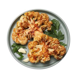 Photo of Delicious baked cauliflower steaks with garlic and parsley isolated on white, top view