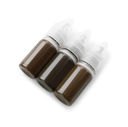 Photo of Bottles of pigments for permanent makeup isolated on white, top view