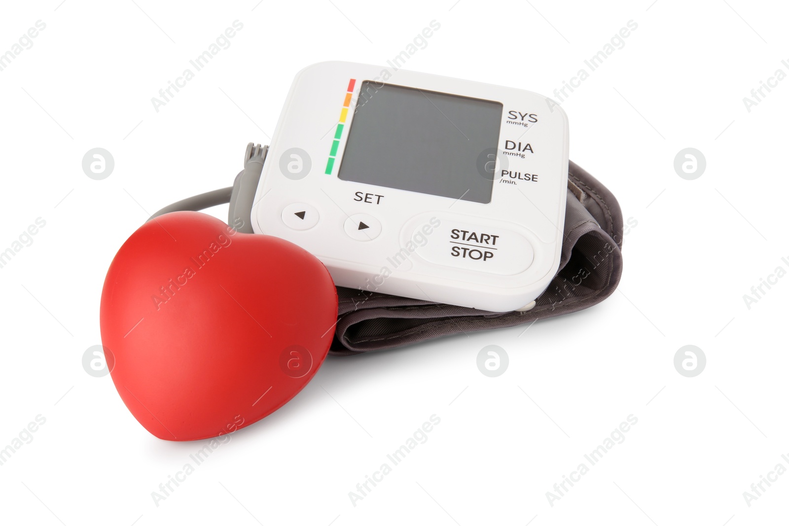 Photo of Blood pressure monitor and red decorative heart isolated on white