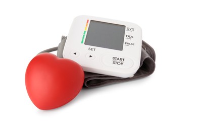 Photo of Blood pressure monitor and red decorative heart isolated on white