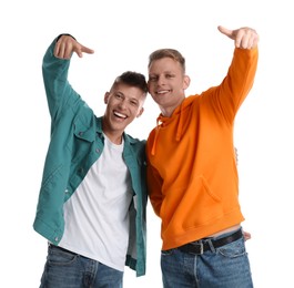 Photo of Two young brothers having fun on white background