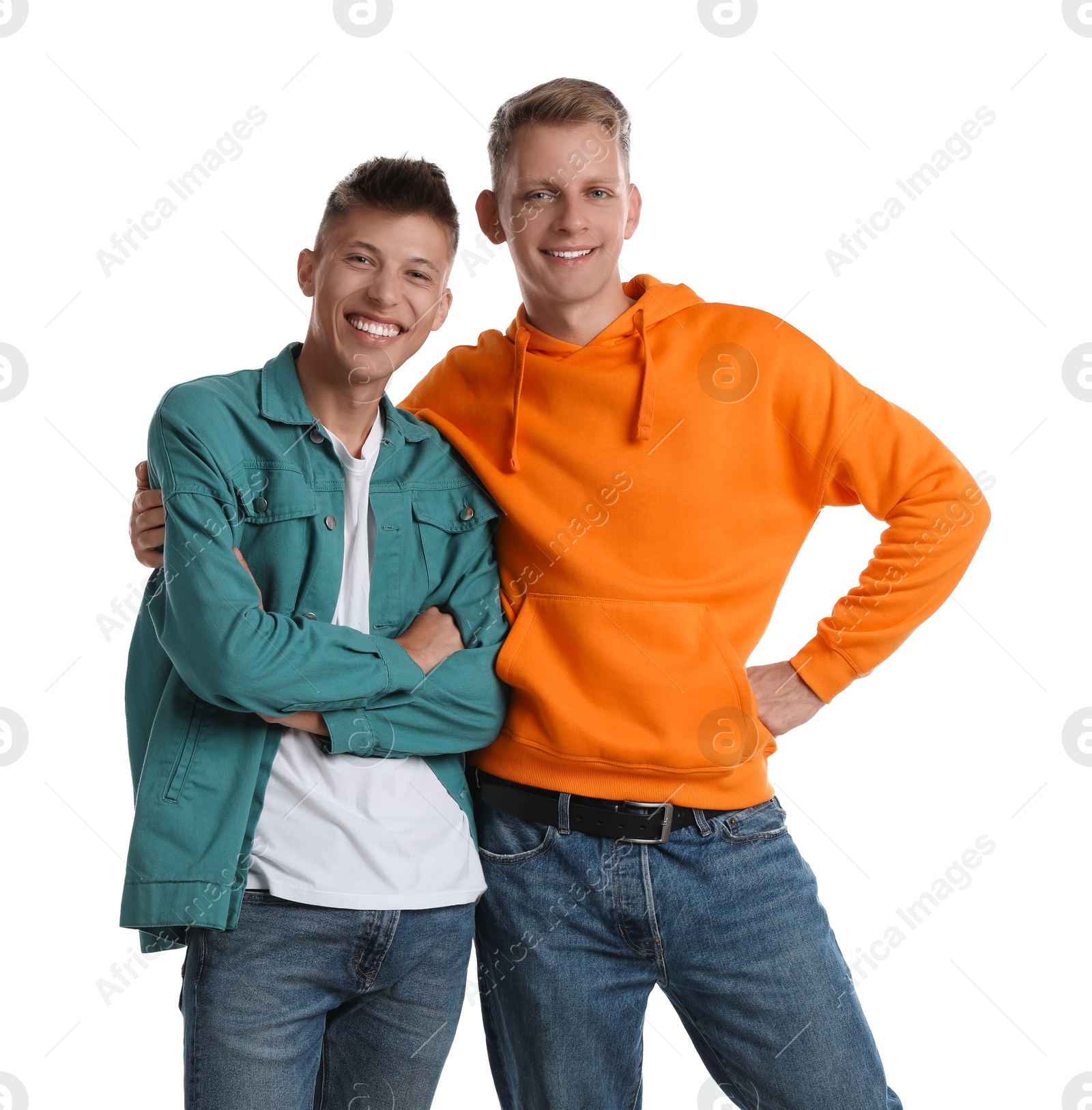 Photo of Two happy brothers posing on white background