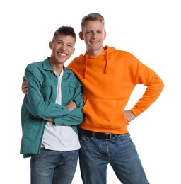 Two happy brothers posing on white background