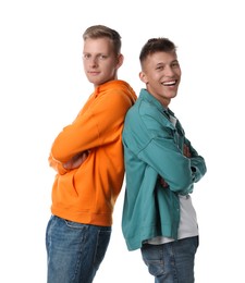 Photo of Two happy brothers posing with crossed arms on white background