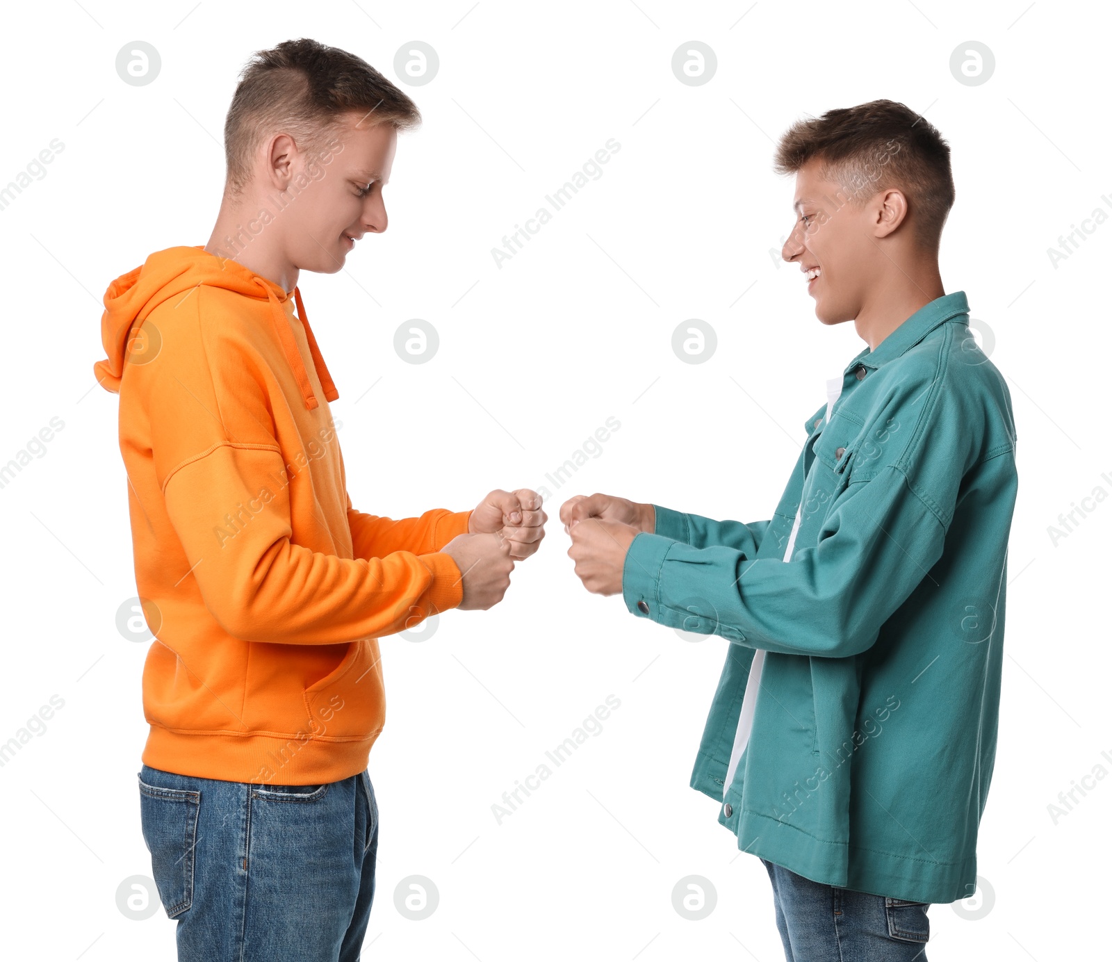 Photo of Two young brothers greeting on white background