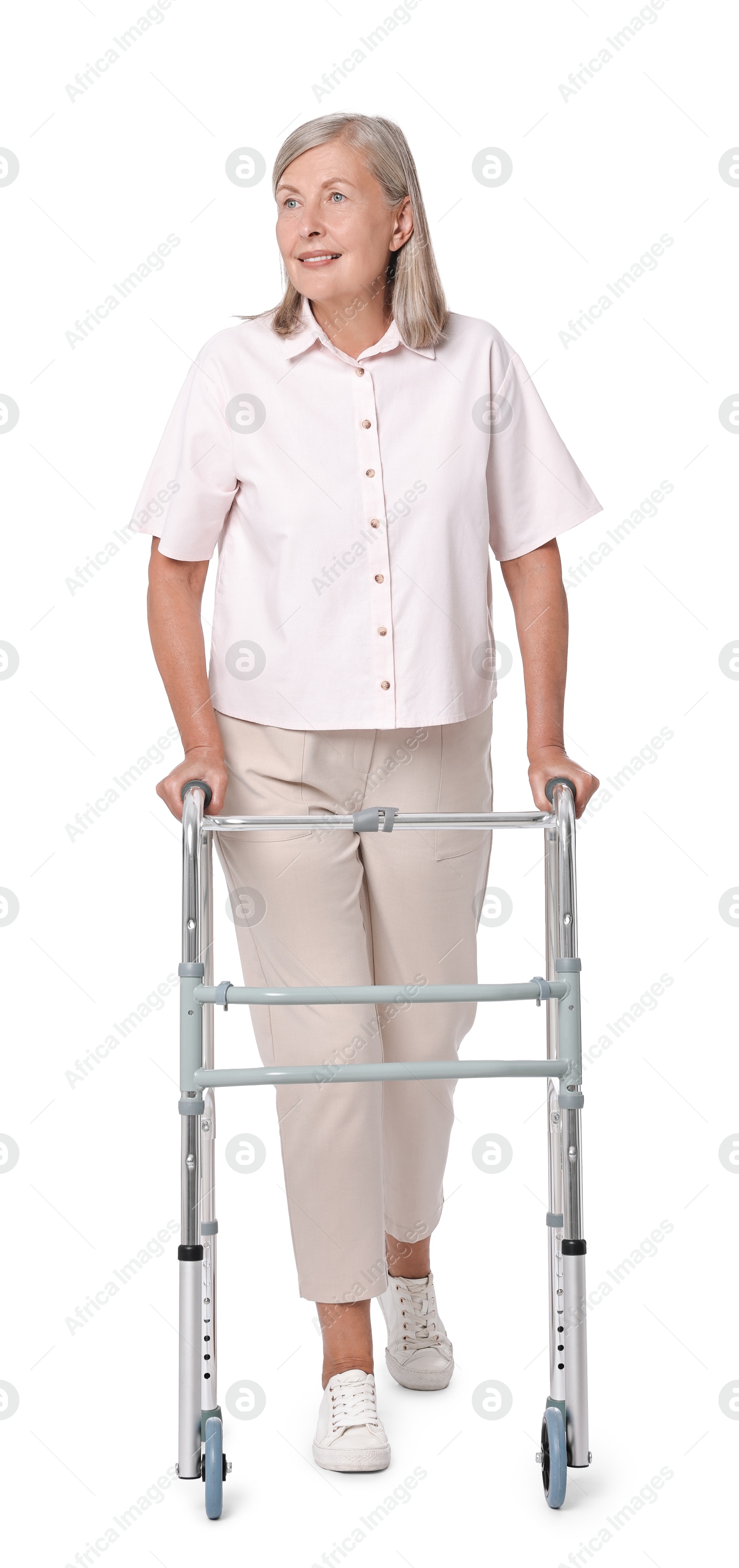 Photo of Senior woman using walking frame on white background