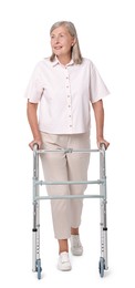 Senior woman using walking frame on white background