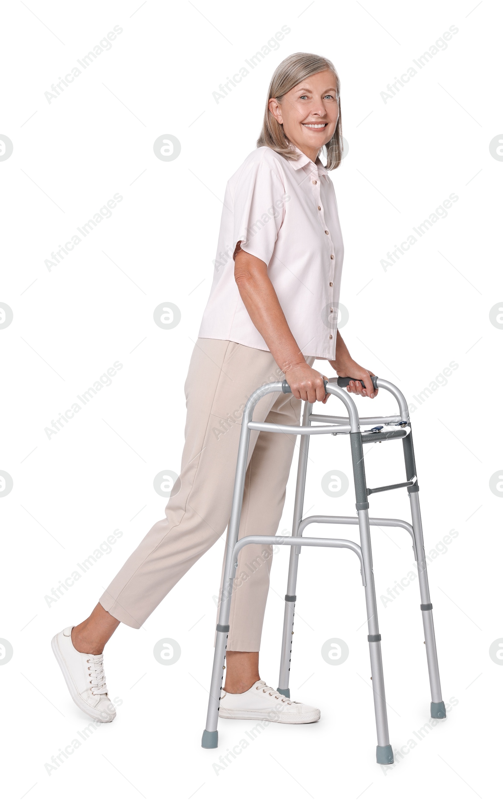 Photo of Senior woman using walking frame on white background