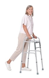 Senior woman using walking frame on white background