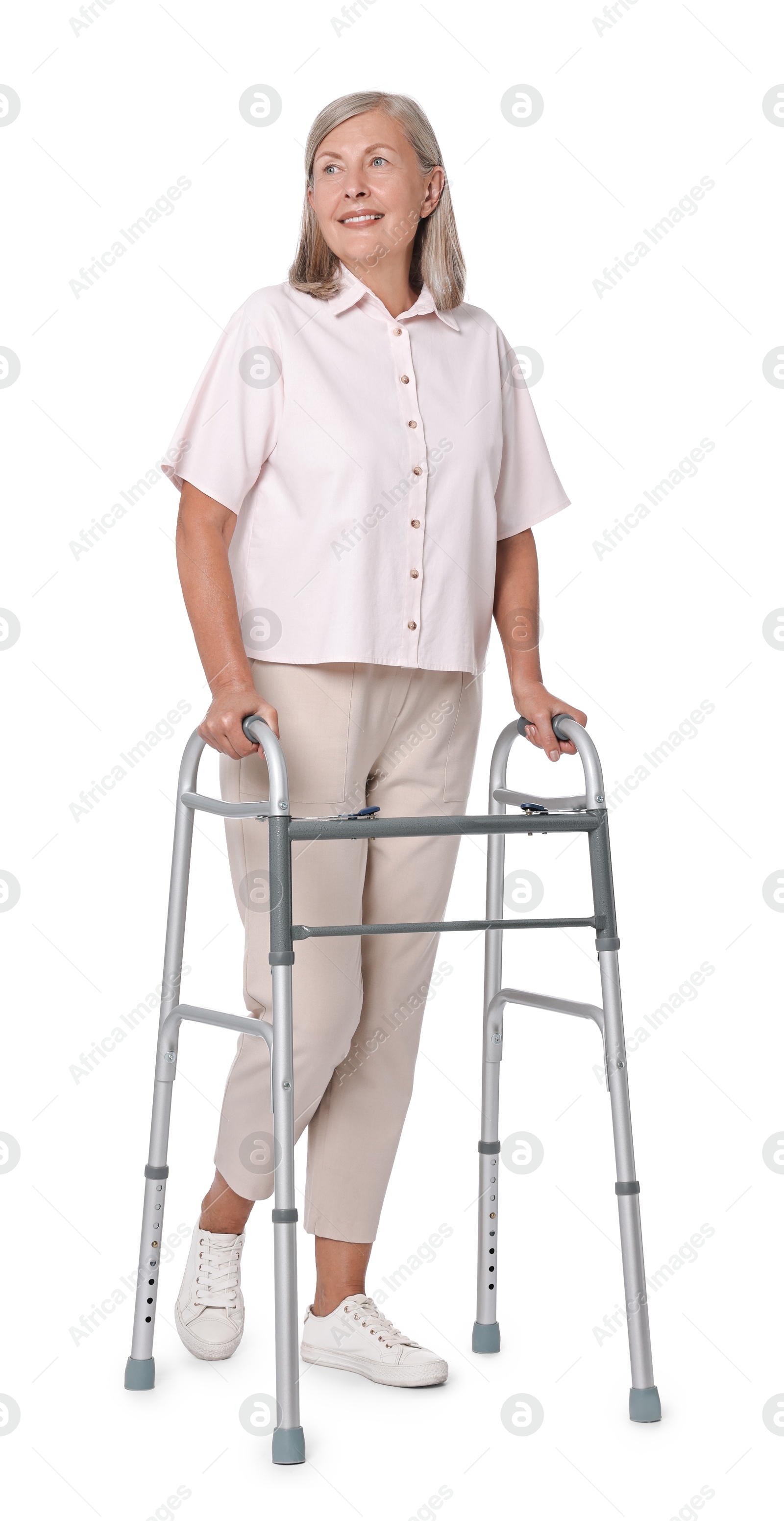 Photo of Senior woman using walking frame on white background