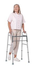 Senior woman using walking frame on white background