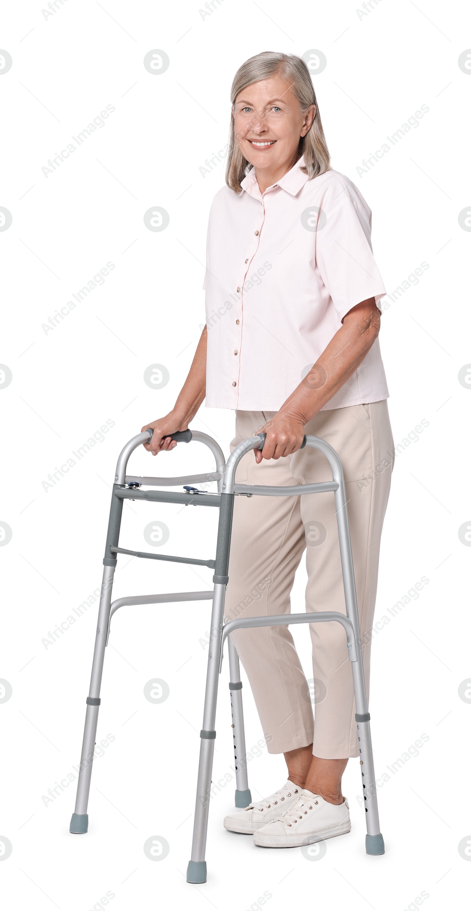 Photo of Senior woman using walking frame on white background