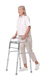 Photo of Senior woman using walking frame on white background