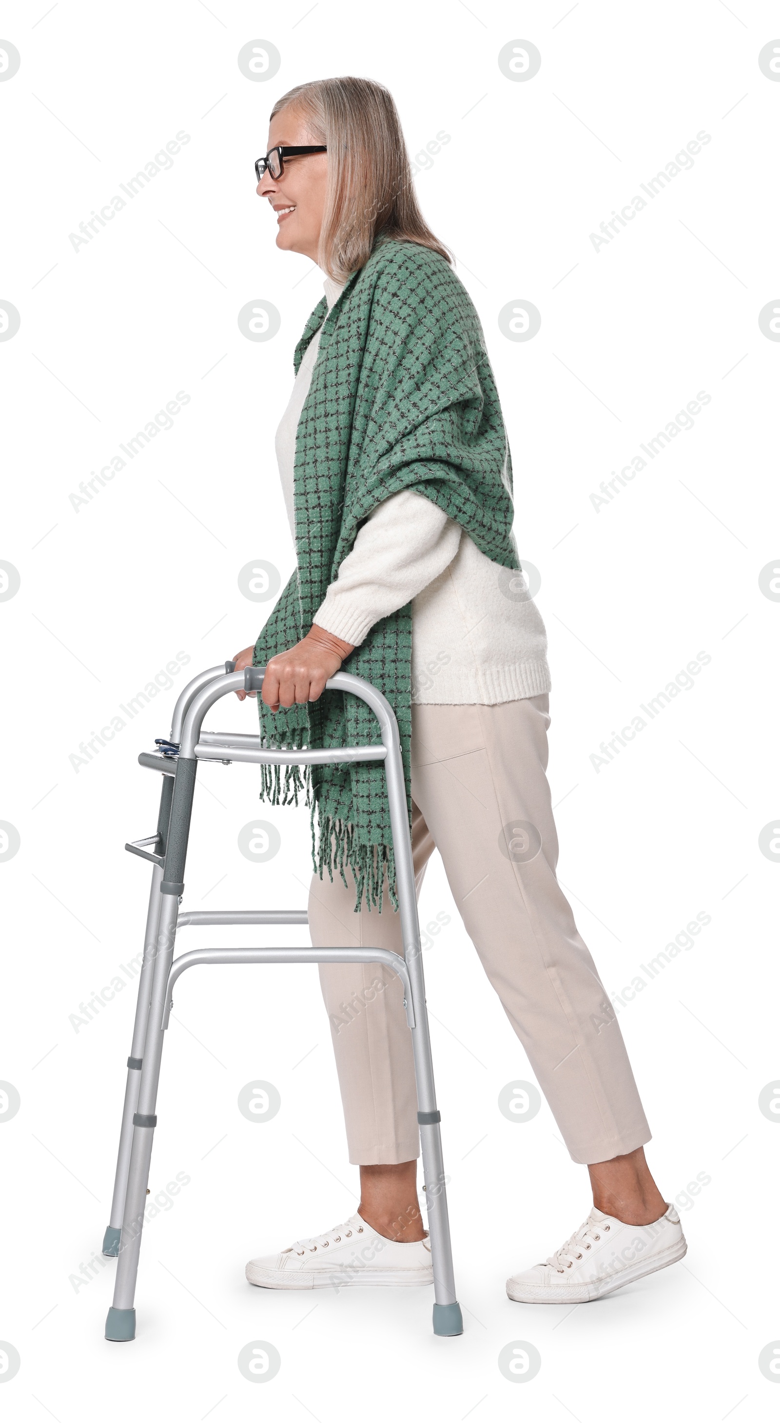 Photo of Senior woman using walking frame on white background