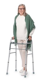 Senior woman using walking frame on white background