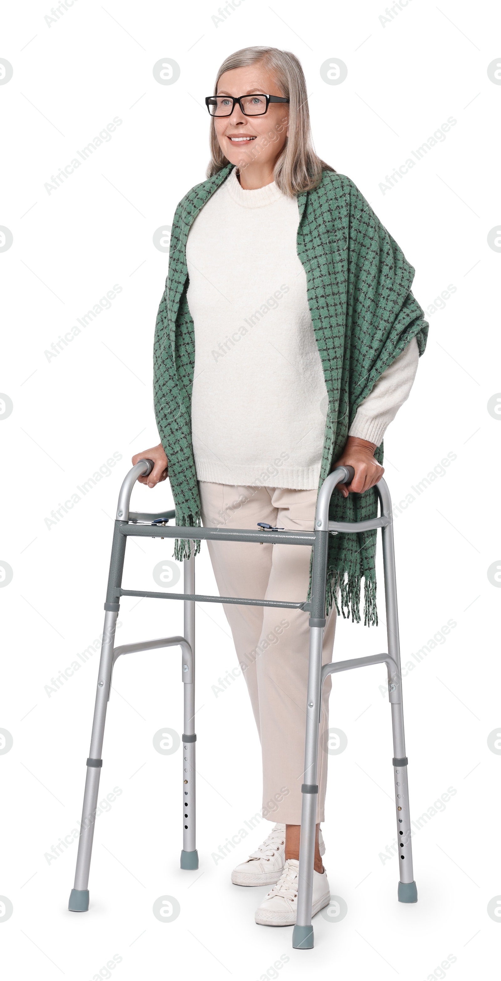 Photo of Senior woman using walking frame on white background