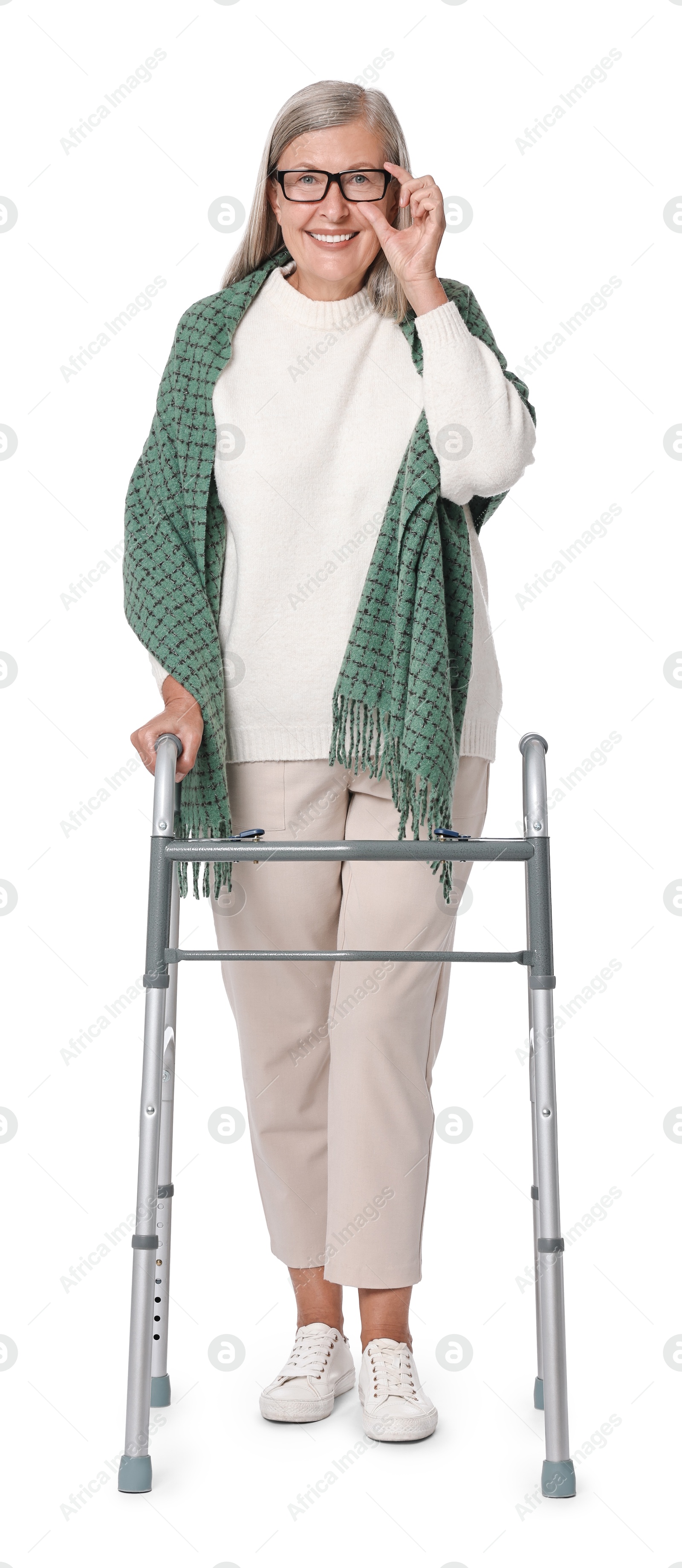 Photo of Senior woman using walking frame on white background