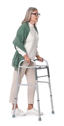 Photo of Senior woman using walking frame on white background