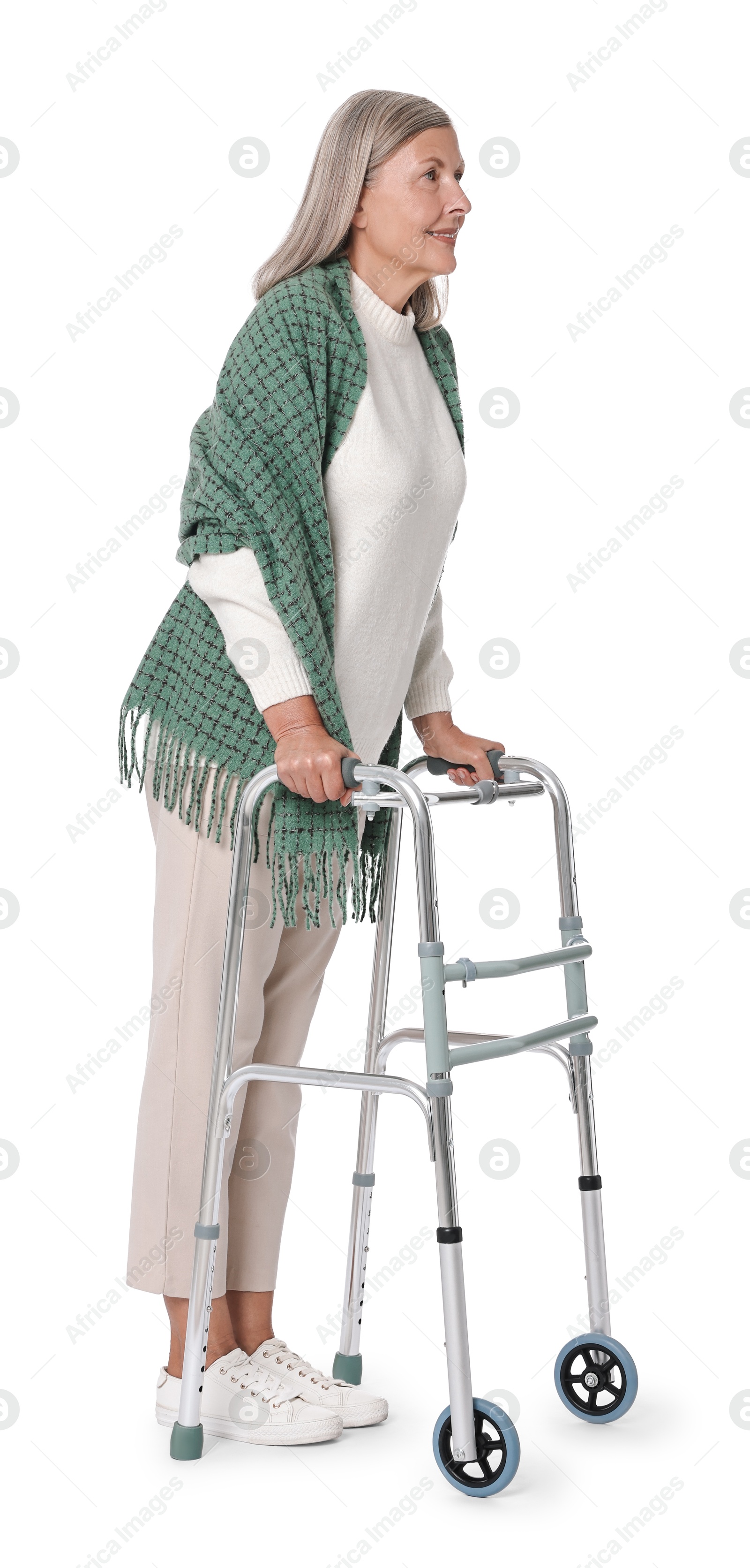 Photo of Senior woman using walking frame on white background