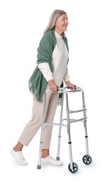 Photo of Senior woman using walking frame on white background