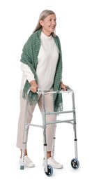 Senior woman using walking frame on white background