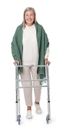 Senior woman using walking frame on white background