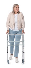 Photo of Senior woman using walking frame on white background