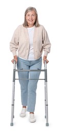 Senior woman using walking frame on white background