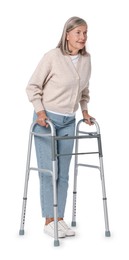 Senior woman using walking frame on white background