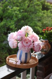 Balcony garden. Beautiful flowers on railings outdoors