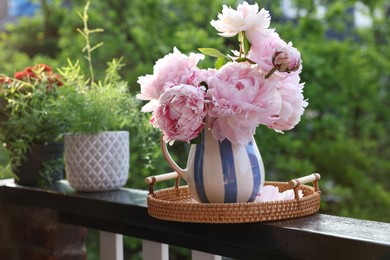 Photo of Balcony garden. Different plants growing on railings outdoors