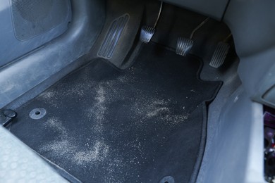 Photo of Black soft car floor mat in auto