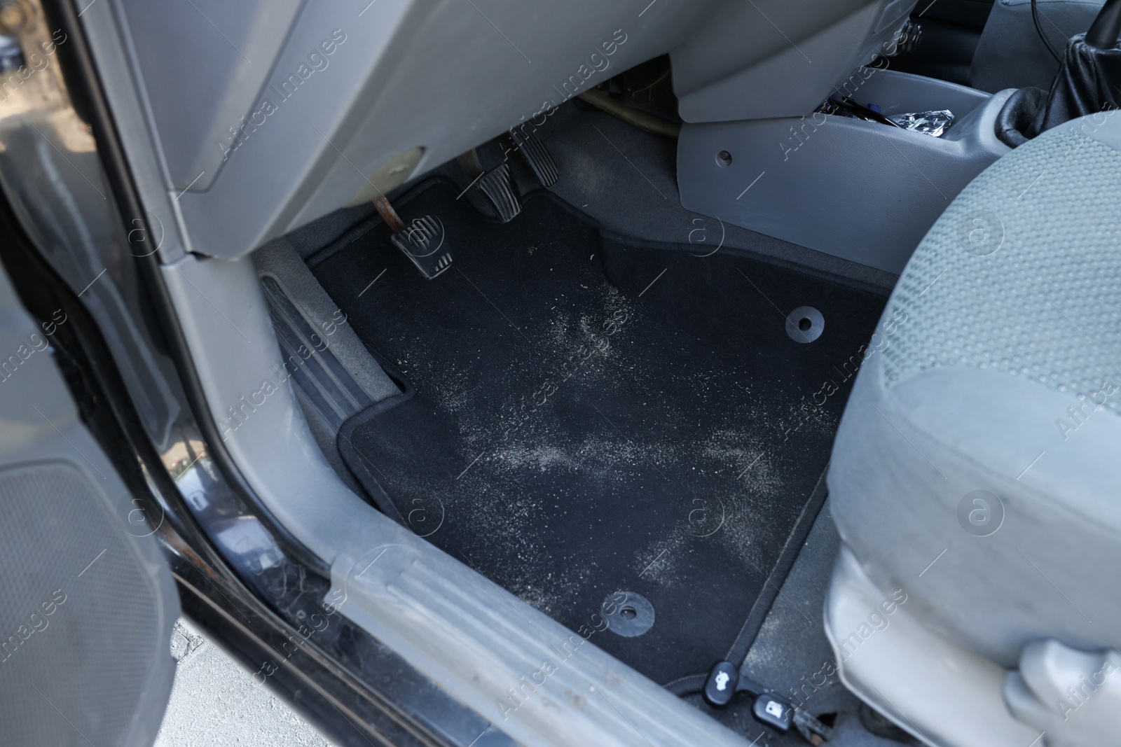 Photo of Black soft car floor mat in auto