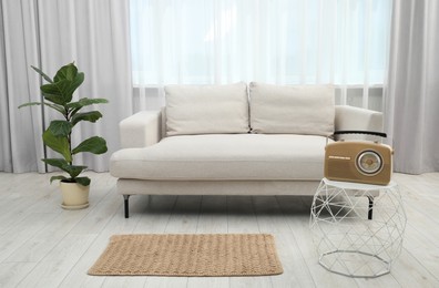 Photo of Comfortable couch in living room. Interior design