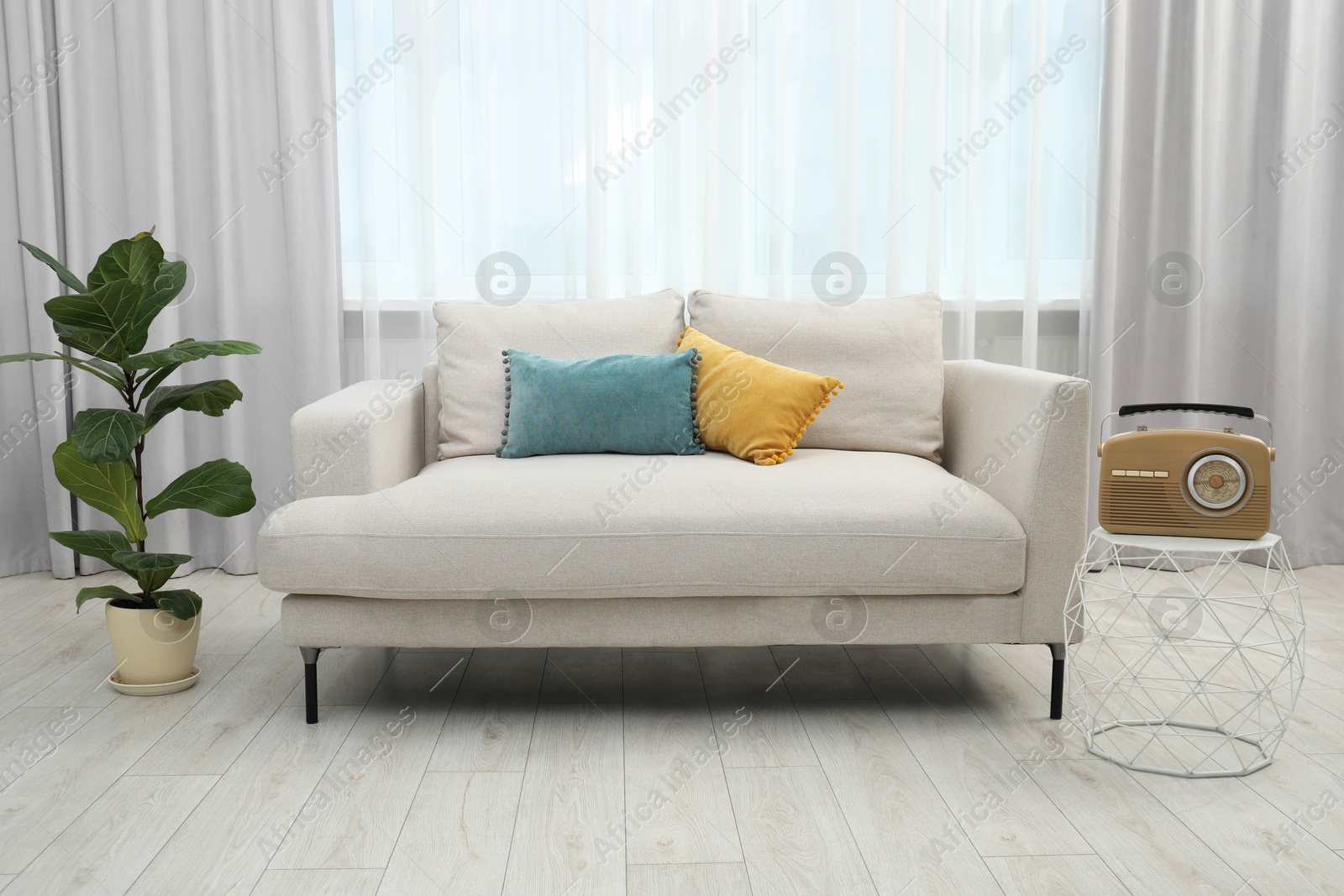 Photo of Comfortable couch in living room. Interior design