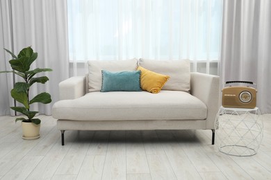 Photo of Comfortable couch in living room. Interior design