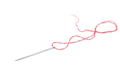 Photo of Sewing needle with red thread isolated on white