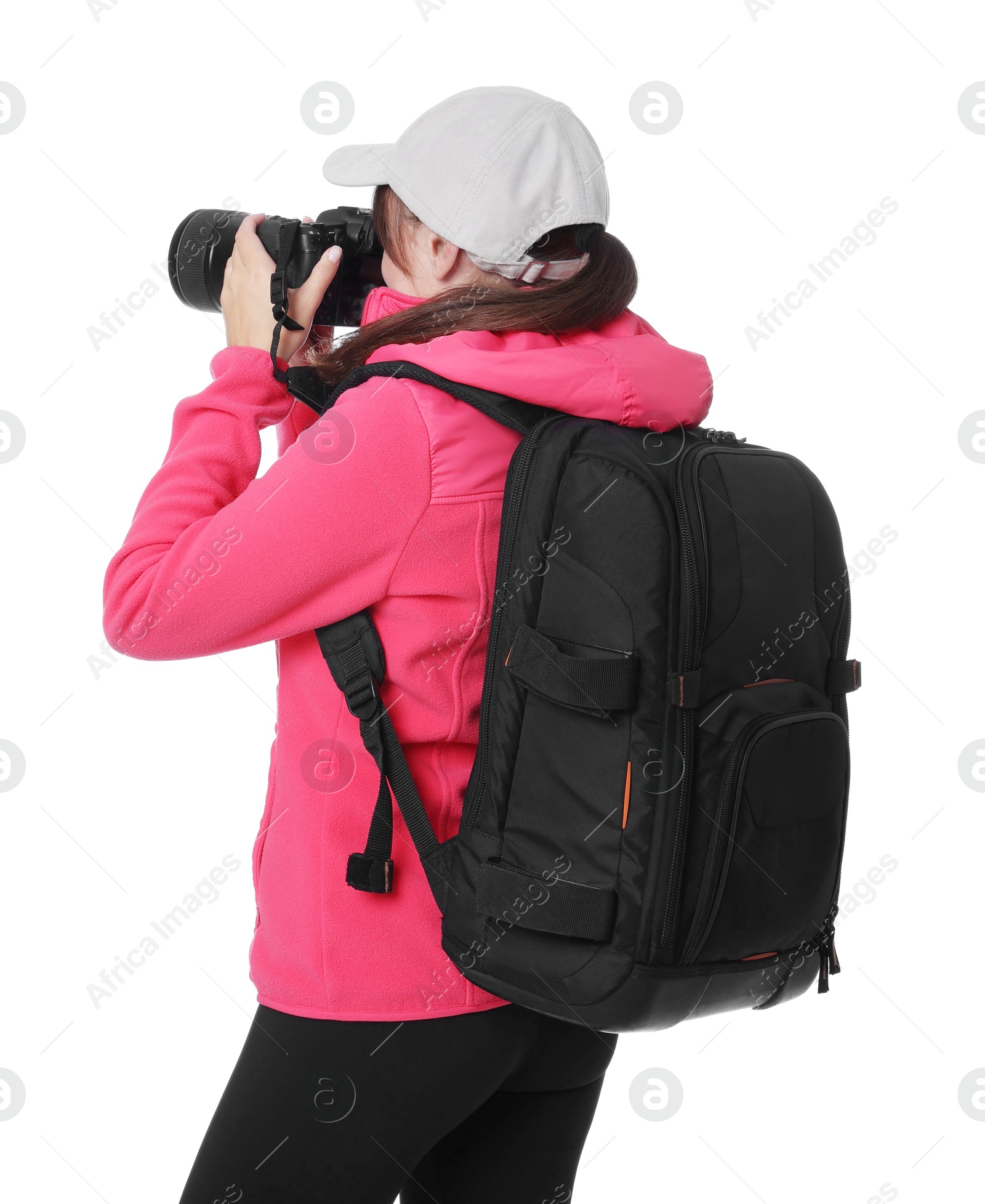 Photo of Photographer with backpack and camera taking picture on white background