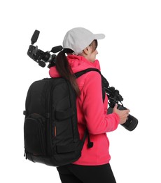 Photo of Photographer with backpack, camera and other professional equipment on white background