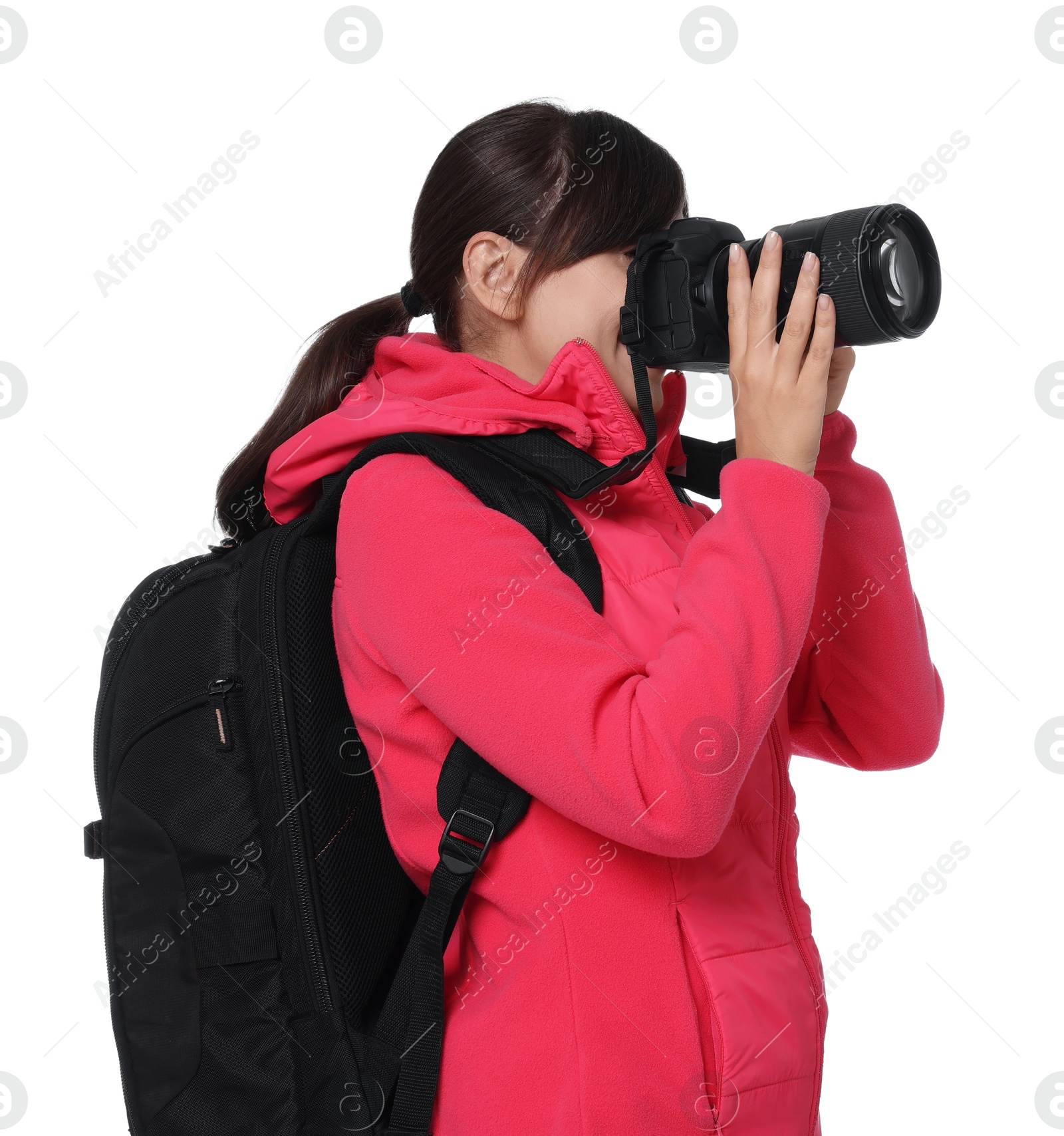 Photo of Photographer with backpack and camera taking picture on white background