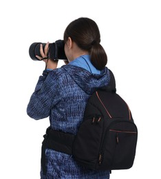 Photographer with backpack and camera taking picture on white background