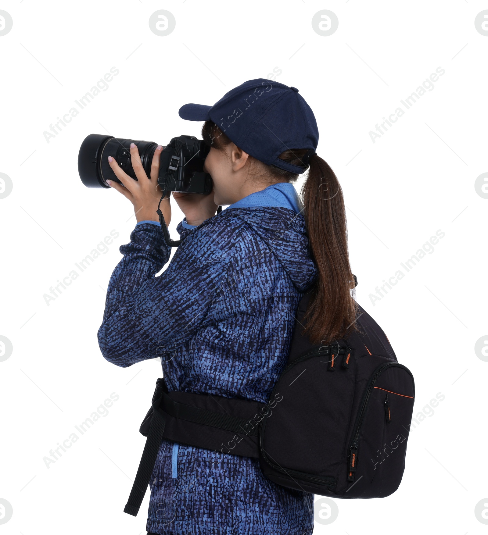 Photo of Photographer with backpack and camera taking picture on white background