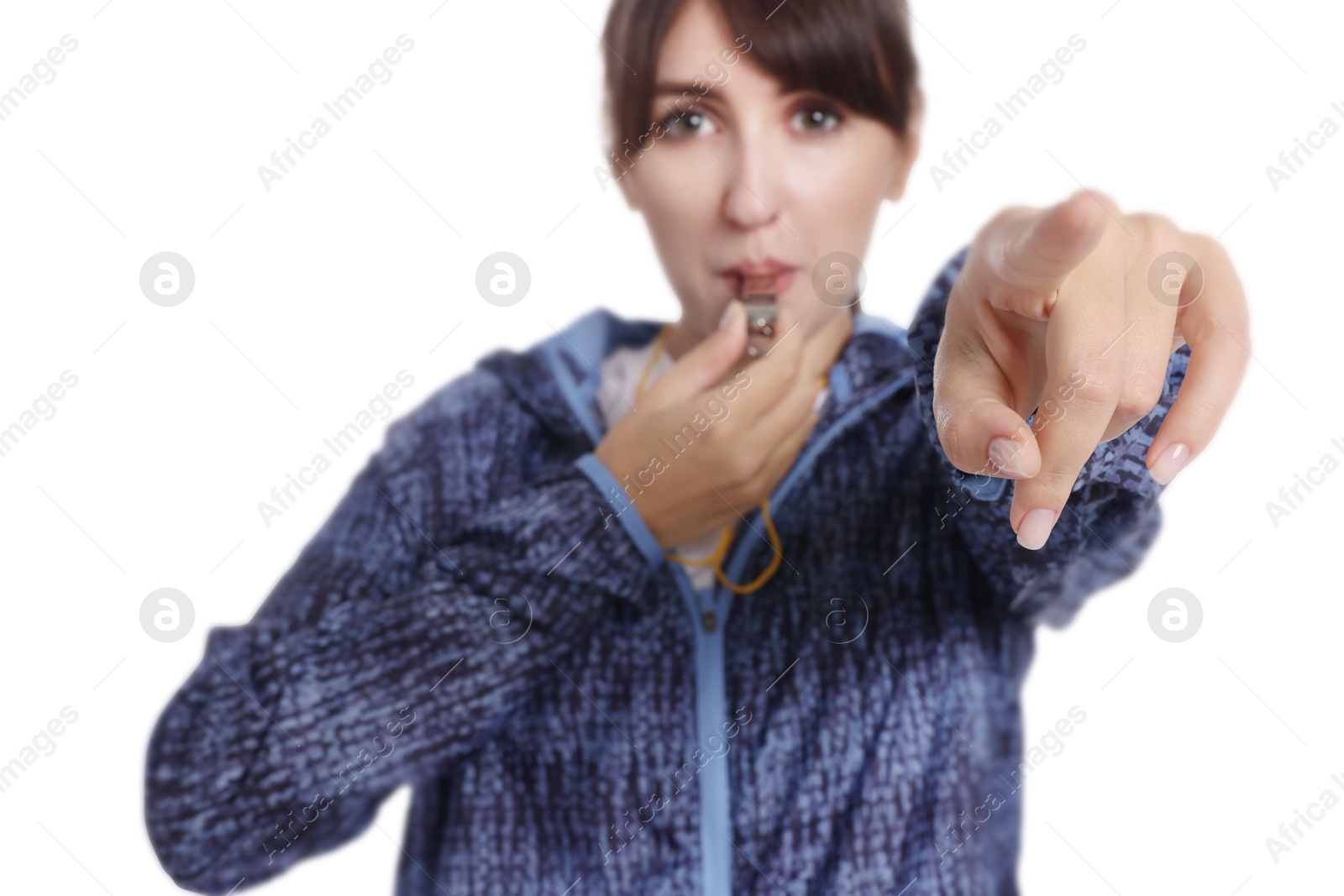 Photo of Woman blowing whistle on white background, selective focus